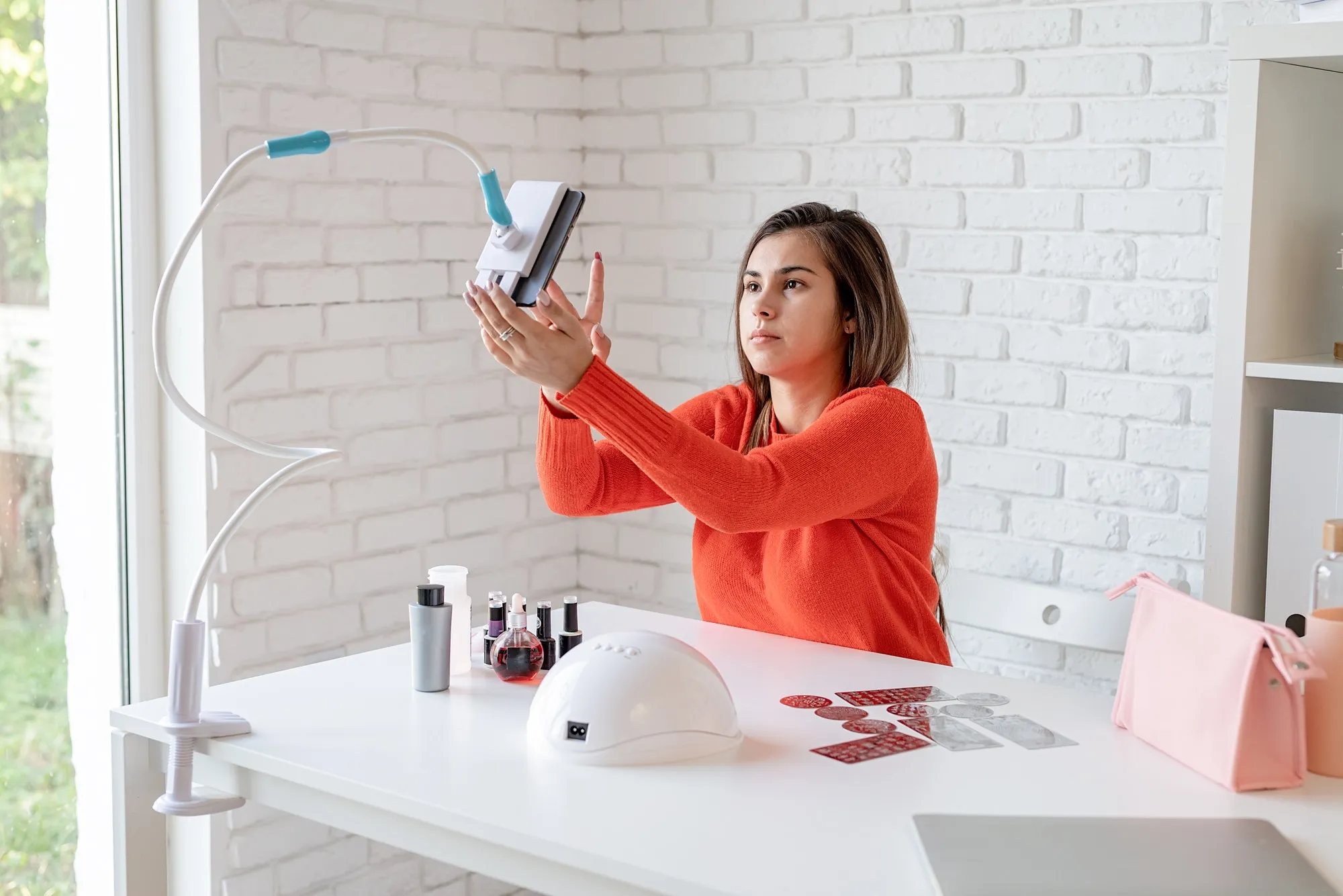 beautiful-caucasian-nail-master-influencer-having-video-chat-or-making-a-blog